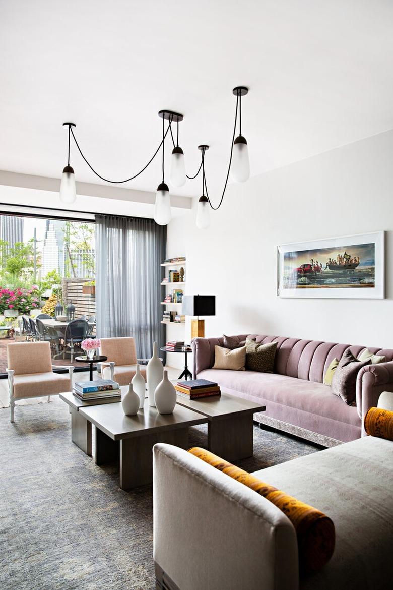 living room with suspension chandelier