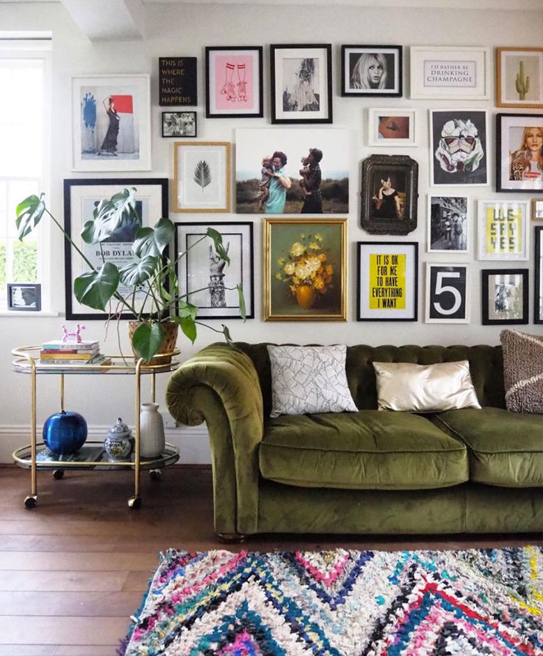 eclectic living room makeover idea with gallery wall and velvet sofa