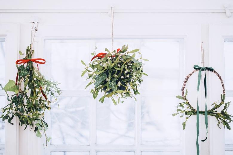 Mistletoe wreath, ball, and traditional hanging cluster all mounted on a ceiing