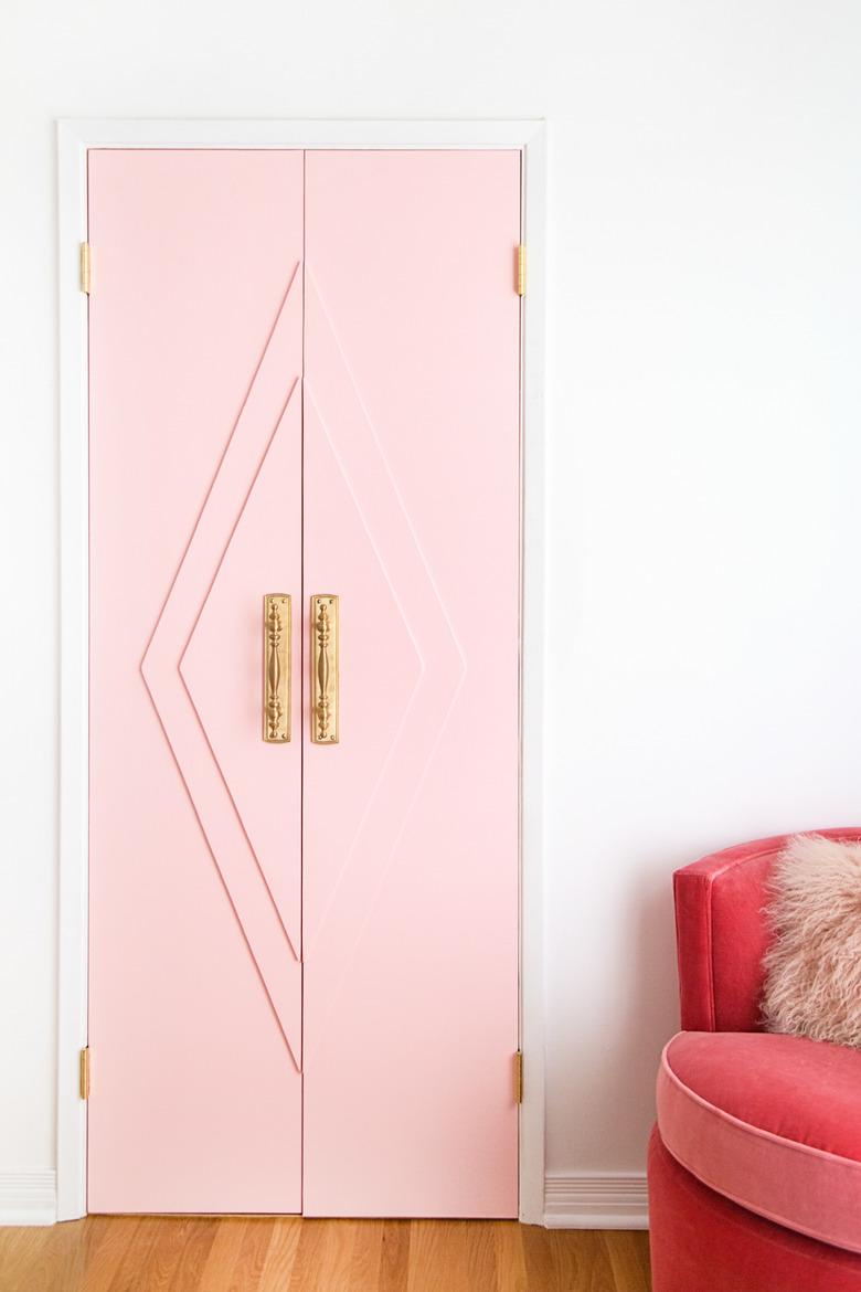 Pink closet door ideas for bedrooms with brass hardware