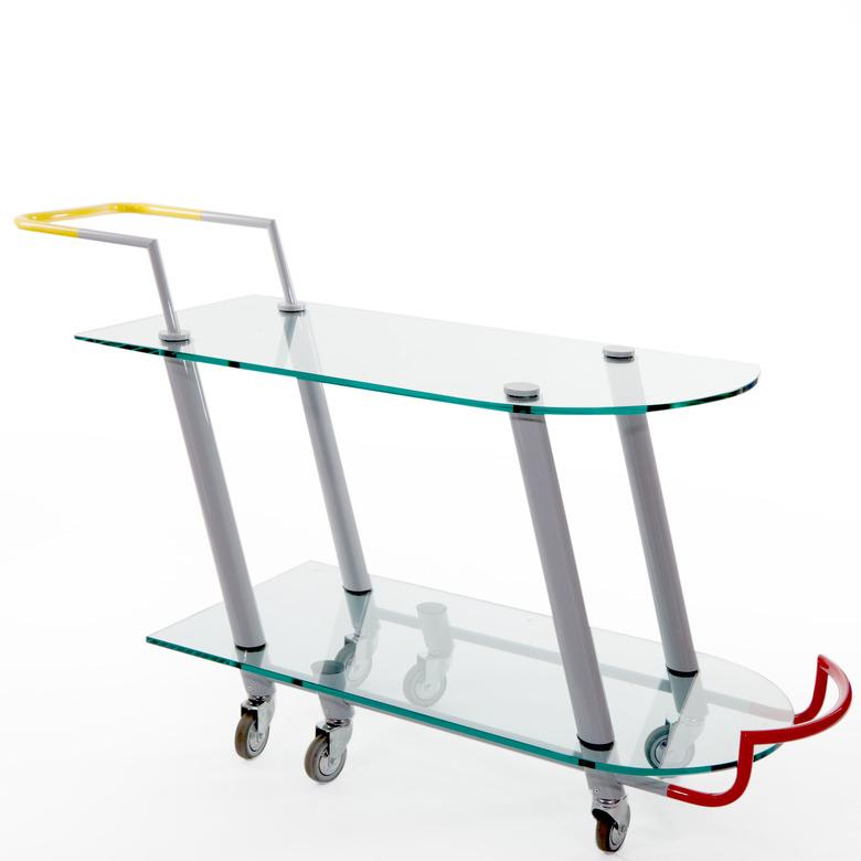 Memphis design style cart with yellow handles designed by Javier Mariscal