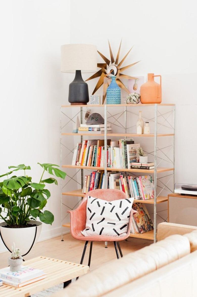 bookcase in midcentury living room with atomic clock