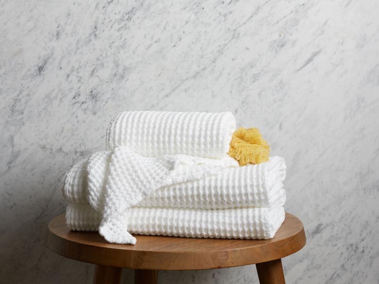 minimalist bathroom toiletries with waffle bath towels