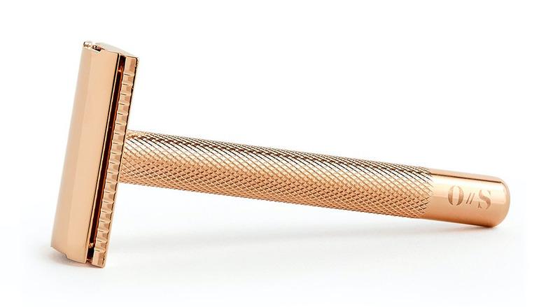 minimalist bathroom toiletries with rose gold razor