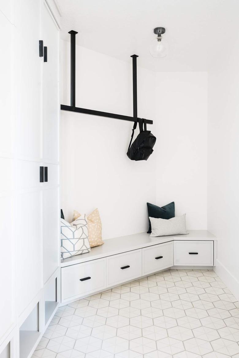 Geometric tile minimalist flooring in black and white minimalist mudroom