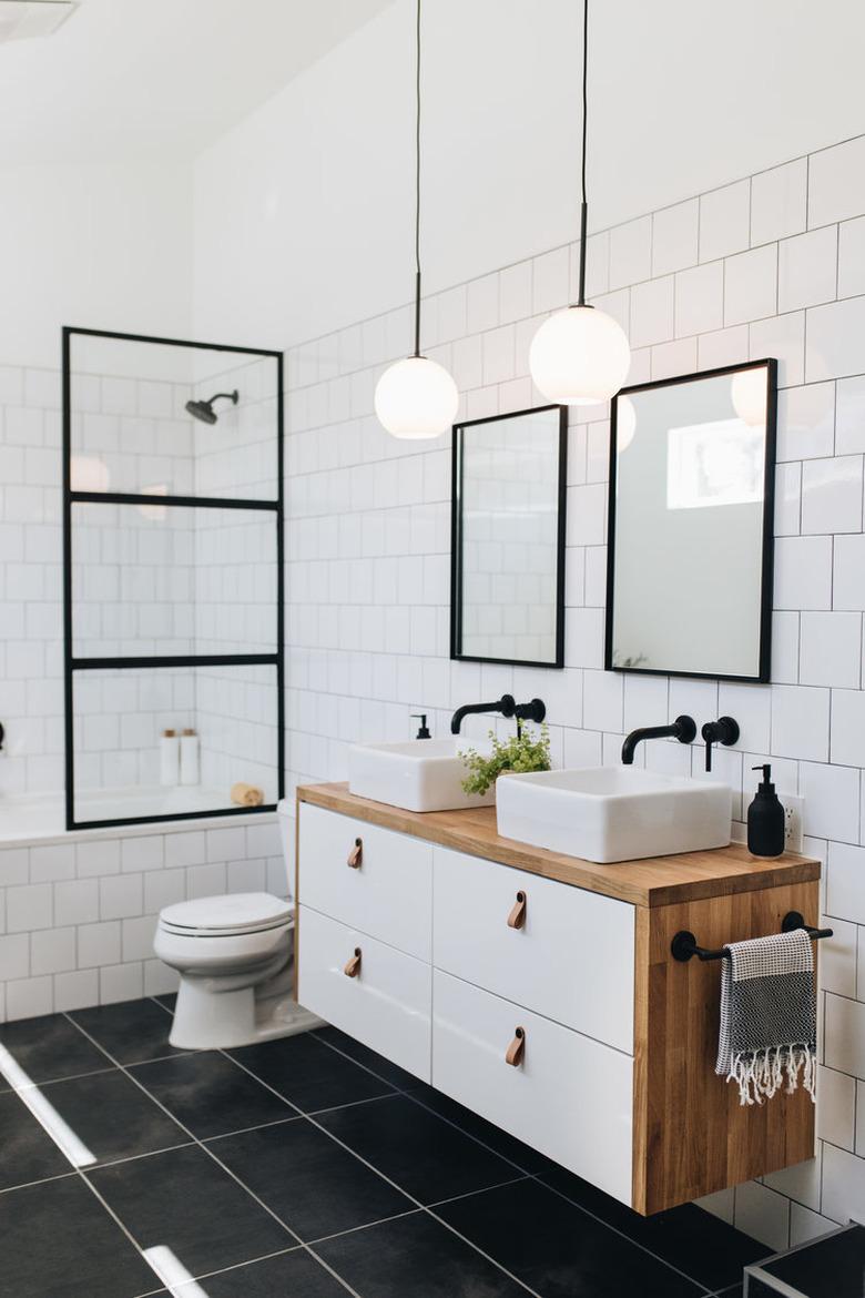 Black tile minimalist flooring in modern black and white bathroom