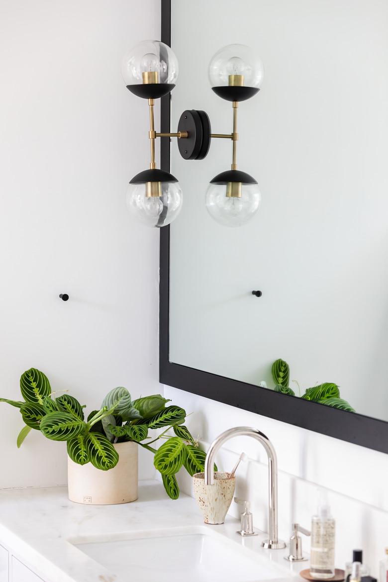 dual bulb minimalist lighting sconce in bathroom