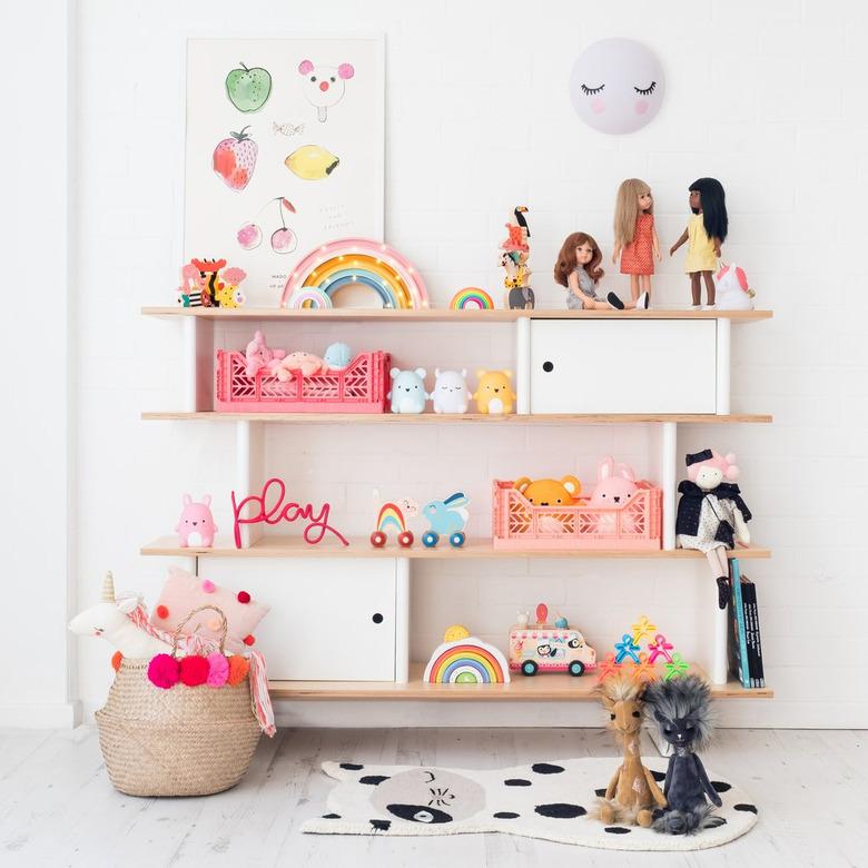 minimalist toy storage idea with bookcase filled with toys