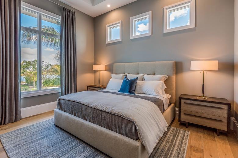 Modern bedroom with wood floor and rug