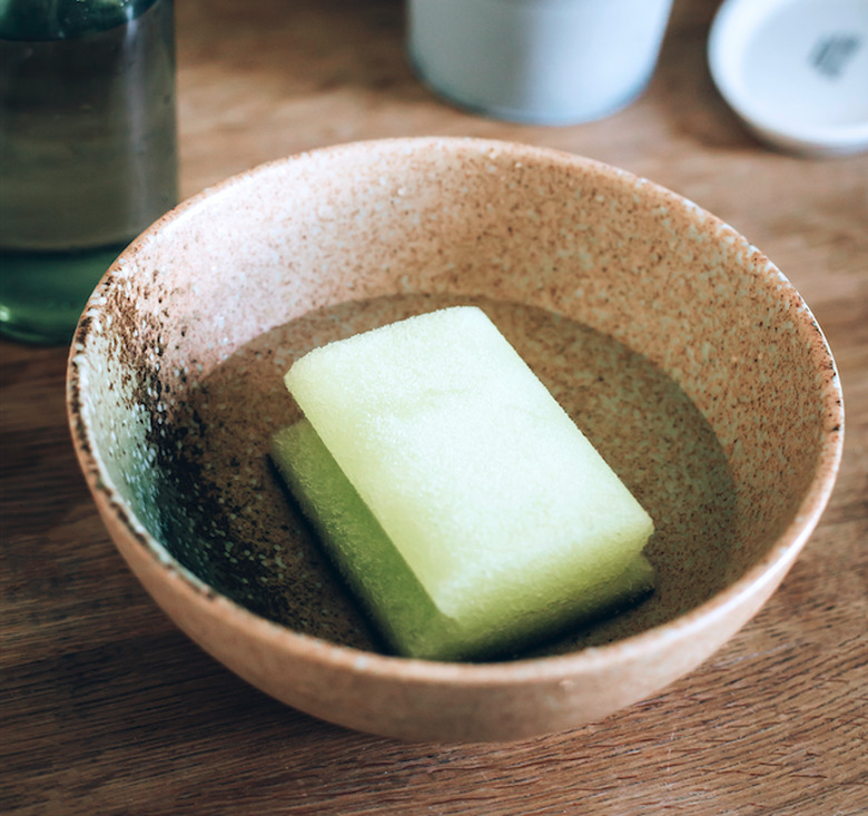 Disinfecting a sponge in a bowl