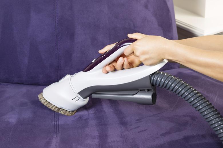 Cleaning Leather Sofa with Vacuum Brush