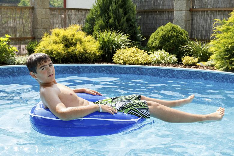 boy in the home swimming pool