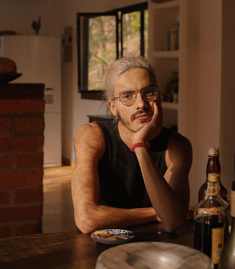 person at table with window in the background