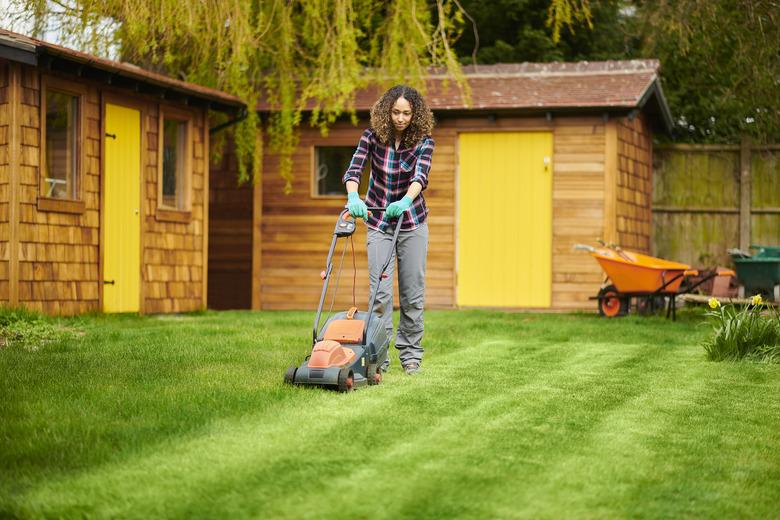 Woman mowing her lawn.