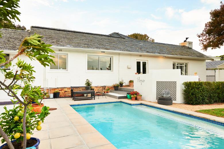 Swimming pool and patio in the backyard of a contemporary home