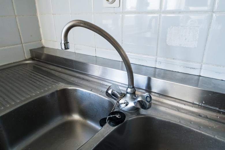 kitchen faucet on a stainless steel sink