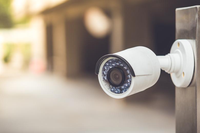 White cctv outside the building, security system