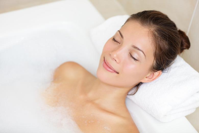 Bathing woman relaxing in bath