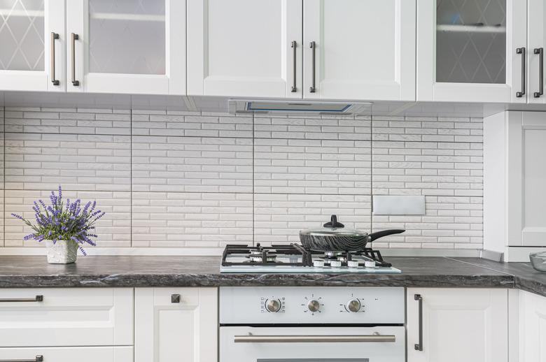 Modern white kitchen interior, front view