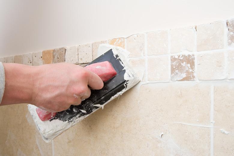 A decorator grouting tiles