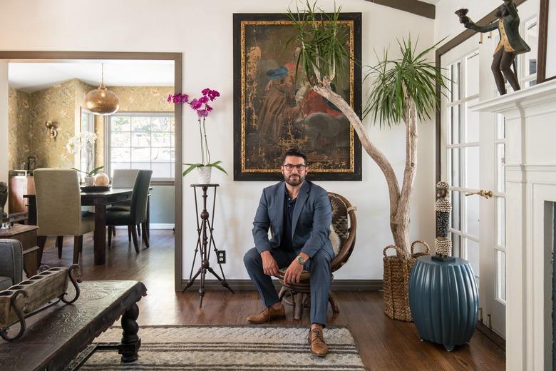 Homeowner Adam Kawalek sits in his Los Angeles home