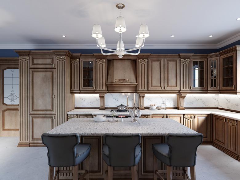 Cherry furniture kitchen island details and bar chairs.