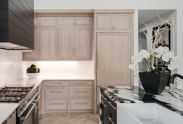 A kitchen with new cabinets and appliances