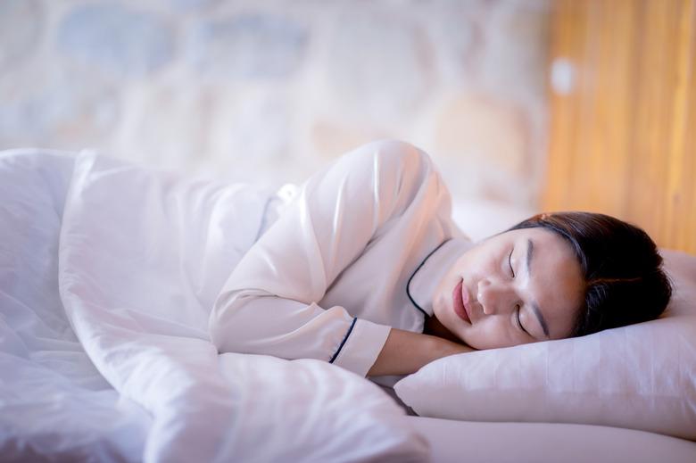 Woman sleep on a pillow.