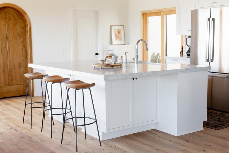 kitchen island with barstools and sink