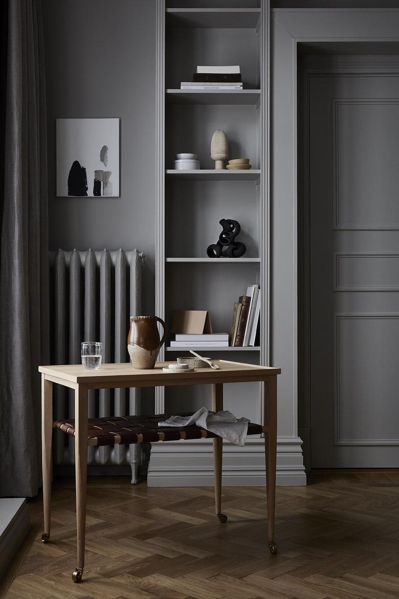 gray tone-on-tone room with built-in bookcase