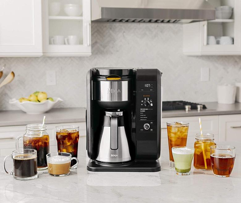 Black coffee maker with stainless steel carafe and eight different drinks