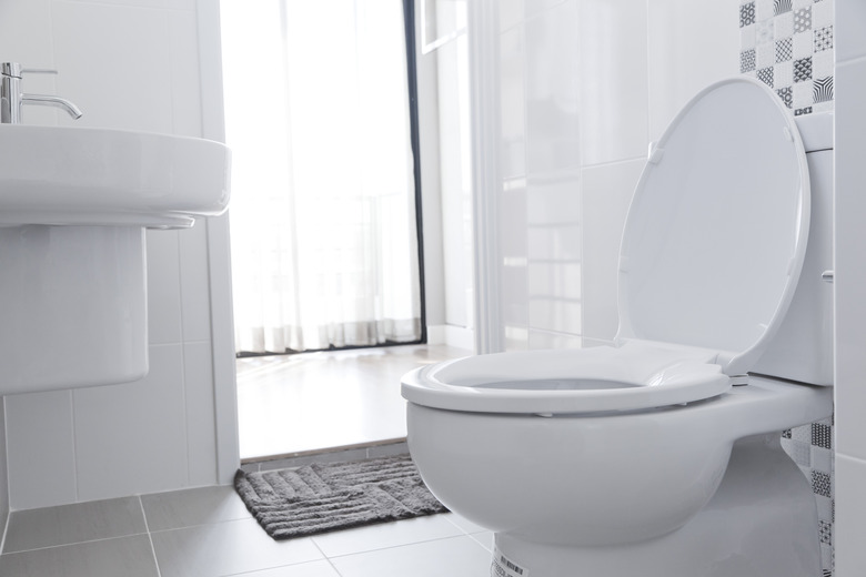 White toilet in home bathroom.