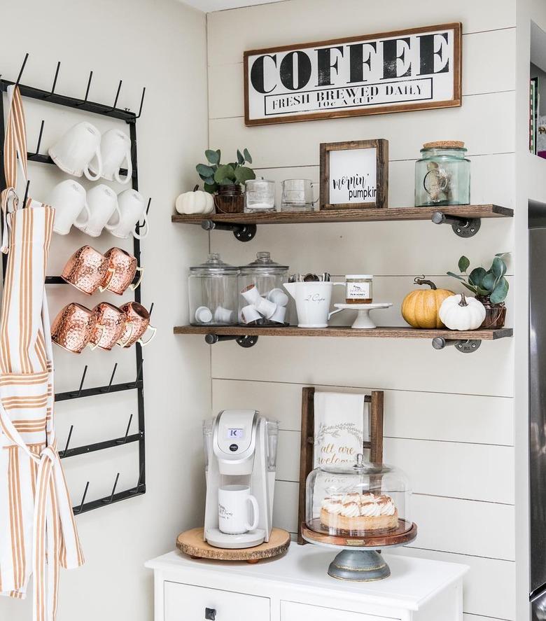 Farmhouse coffee bar in small corner with mug rack and white shiplap