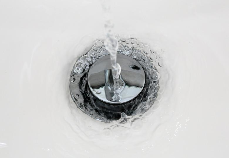 Draining water from a sink that foams in from a new clean bathroom