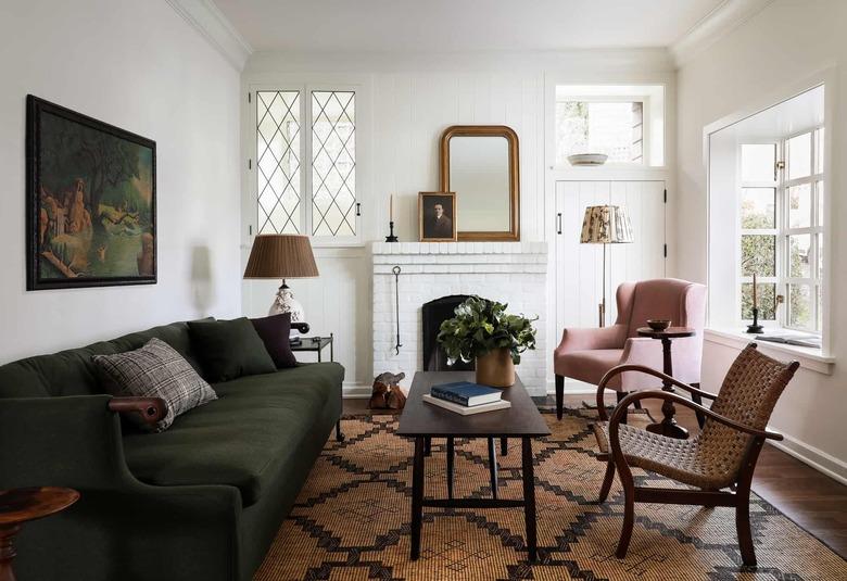 traditional mantel decor with portrait, candlestick, and vintage mirror