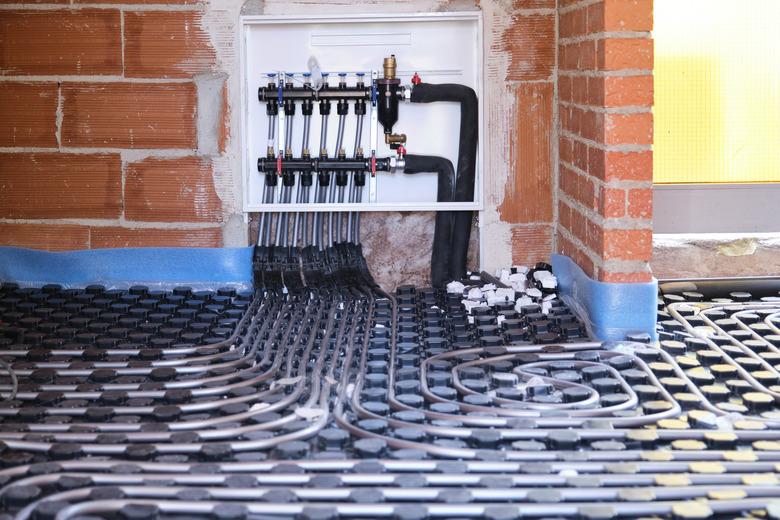 Radiant underfloor heating hydronic manifold with flexible tubing.