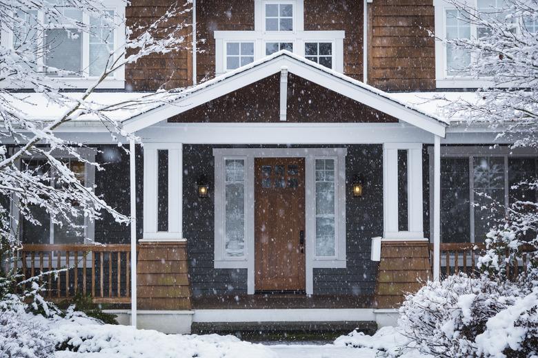 Snow falling near house