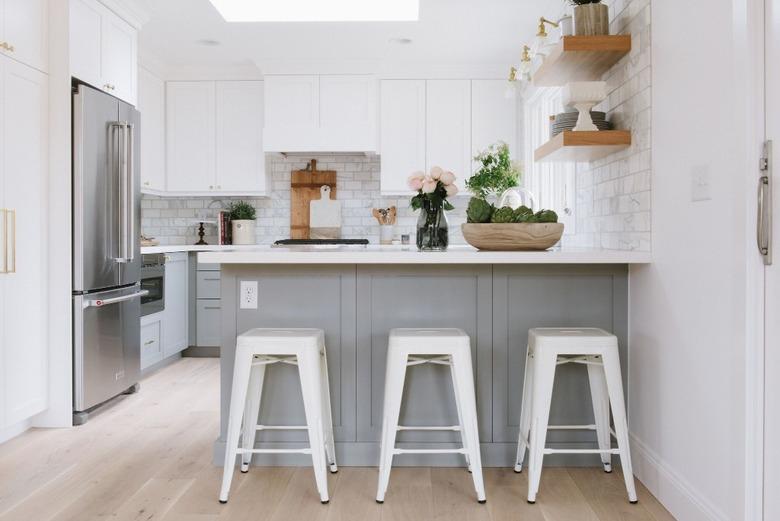 kitchen with gray cabinets and light wood floors