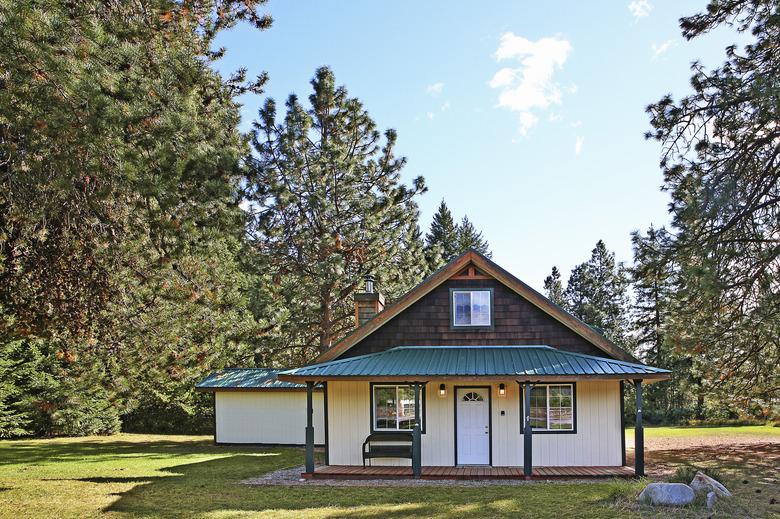 Modern cabin in rural forest.