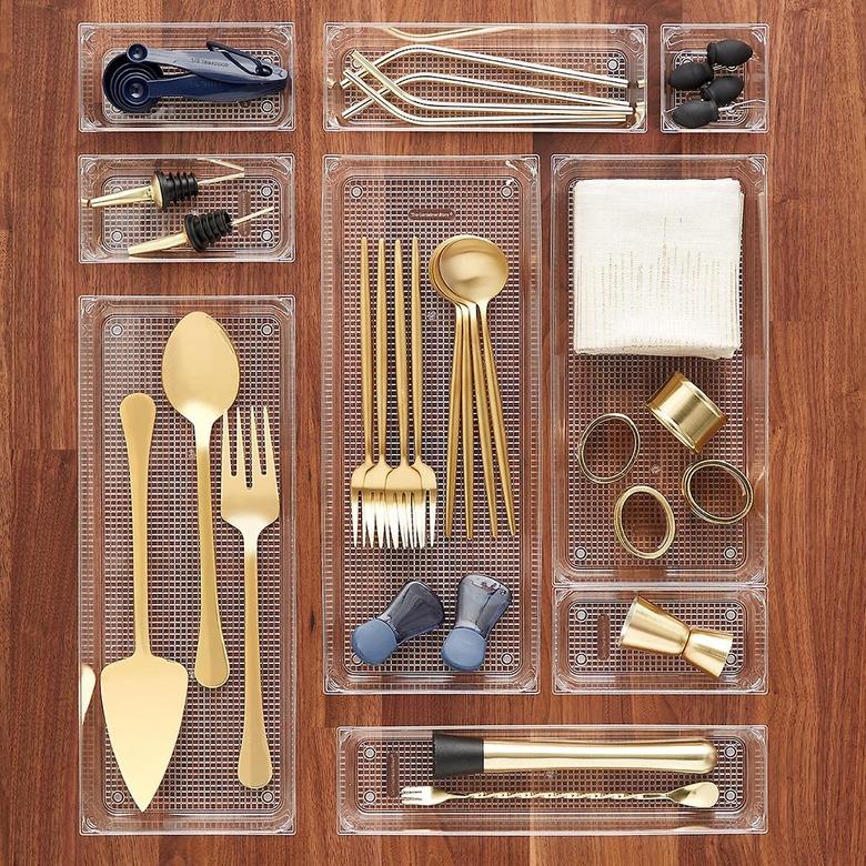 Drawer organizers on a wooden background