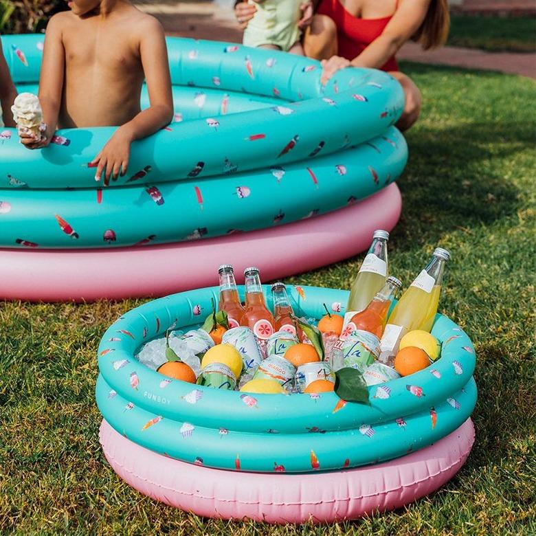 Blow-up pool with matching teal and pink blow-up cooler