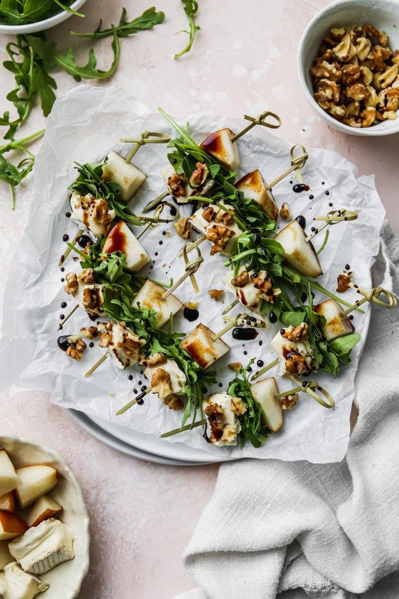 overhead shot of table with plate with salad skewers on it