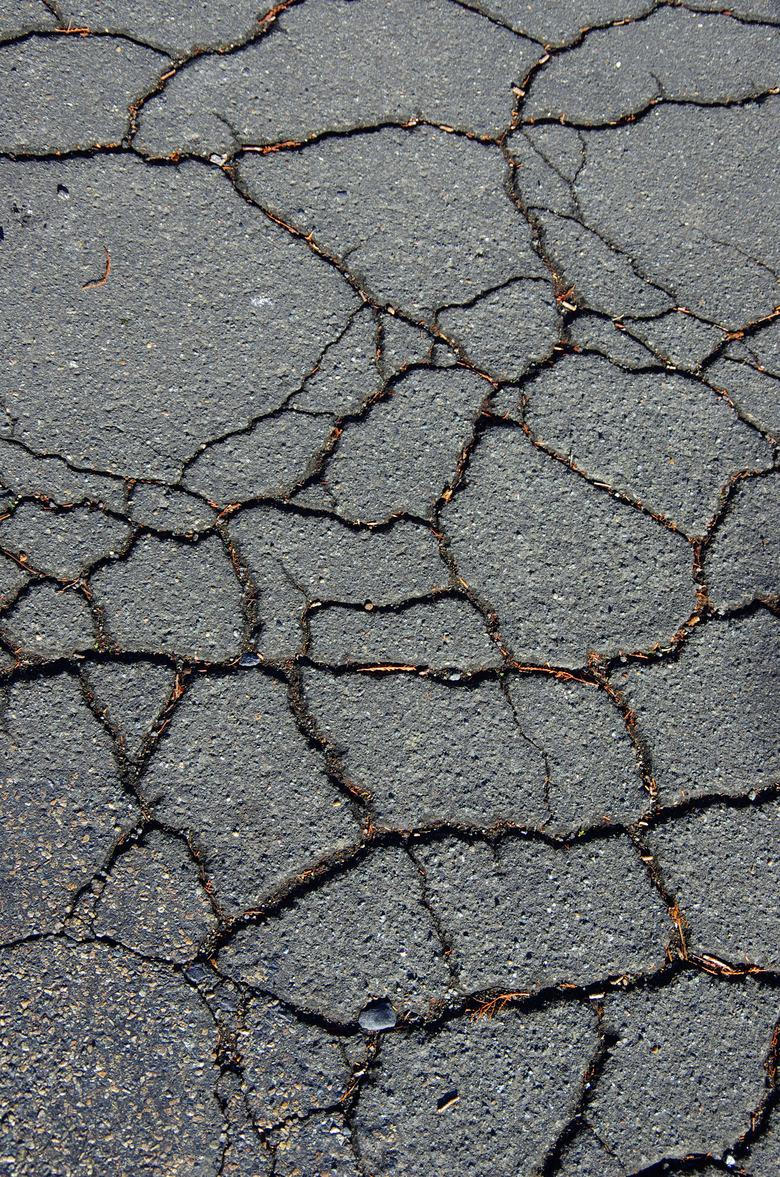 Cracked asphalt road.