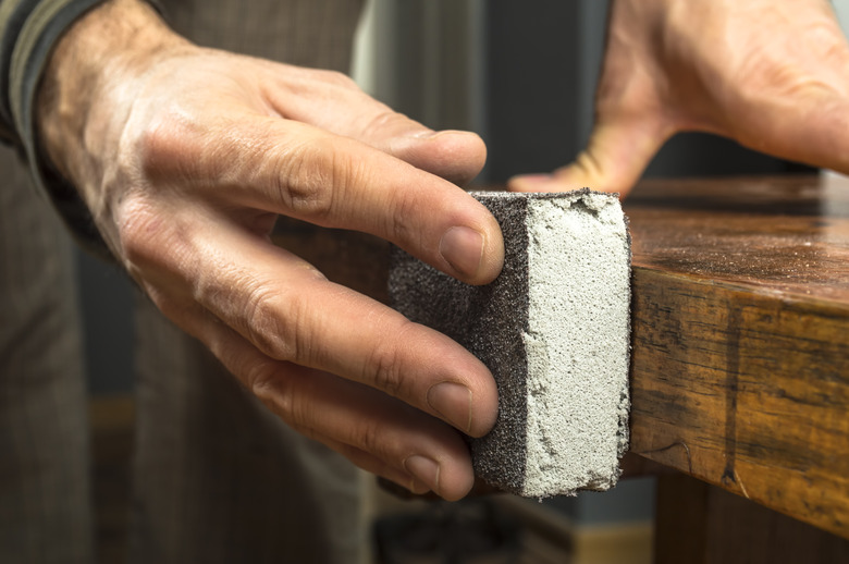 Handyman working with sandpaper