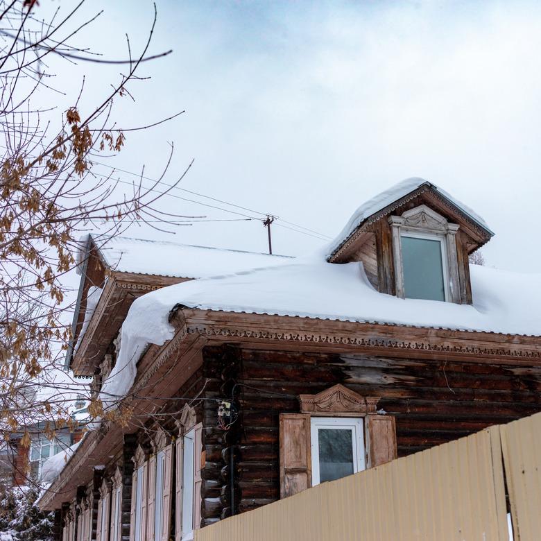 Wooden houses under the snow