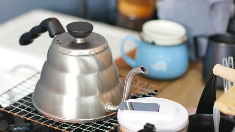 Close-Up Of coffee pot On Camping Stove