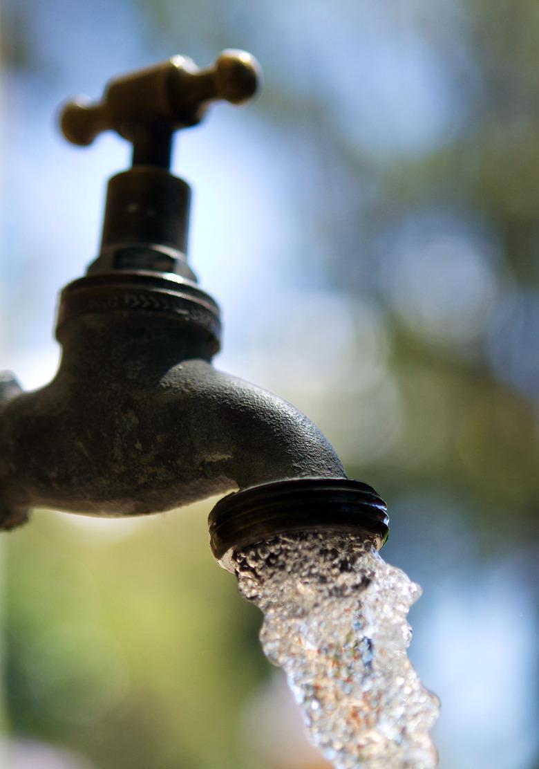 Water flows from a garden tap.