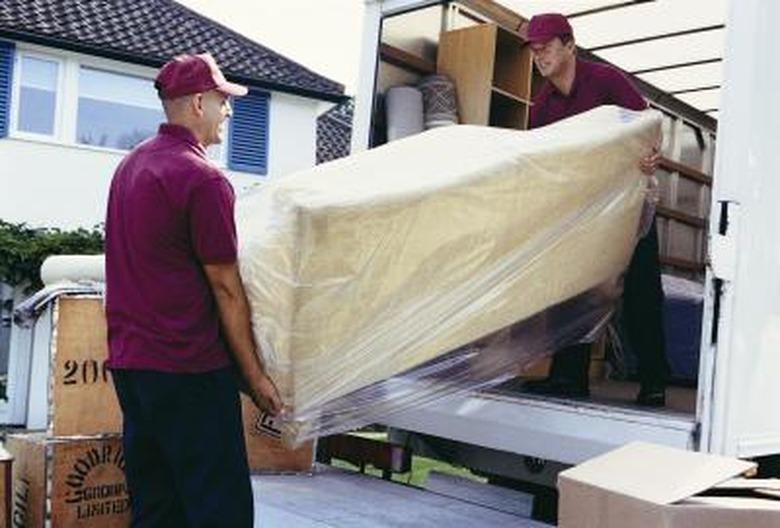 Loading sofa on truck.