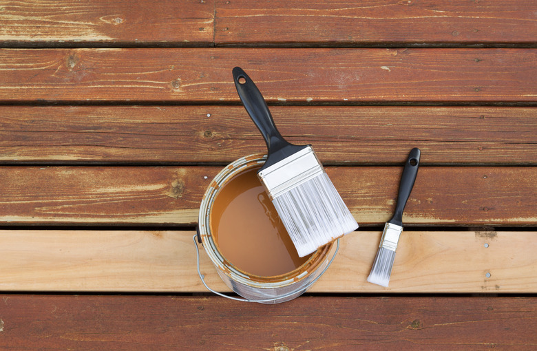 Paint Brush on top of open can of stain