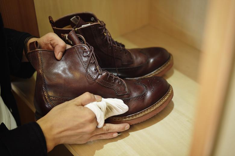 Polishing leather boots.